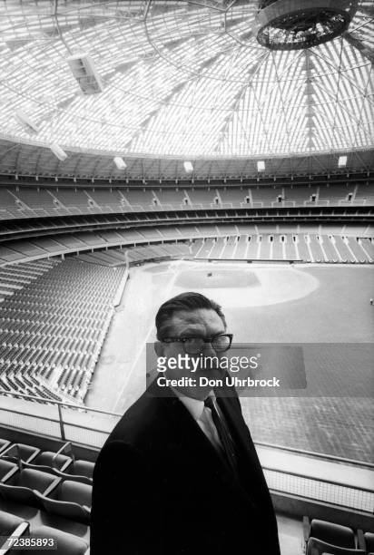 Judge Roy Hofheinz, owner of the Houston Astros, standing in the just completed Houston Astrodome.