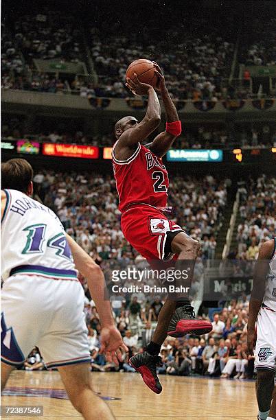 Michael Jordan of the Chicago Bulls takes a shot at the basket during game five of the NBA Finals against the Utah Jazz at the Delta Center in Salt...