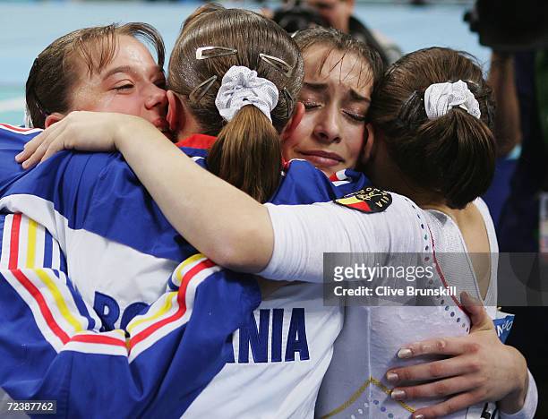 The Romania team celebrate winning the women's artistic gymnastics team final on August 17, 2004 during the Athens 2004 Summer Olympic Games at the...
