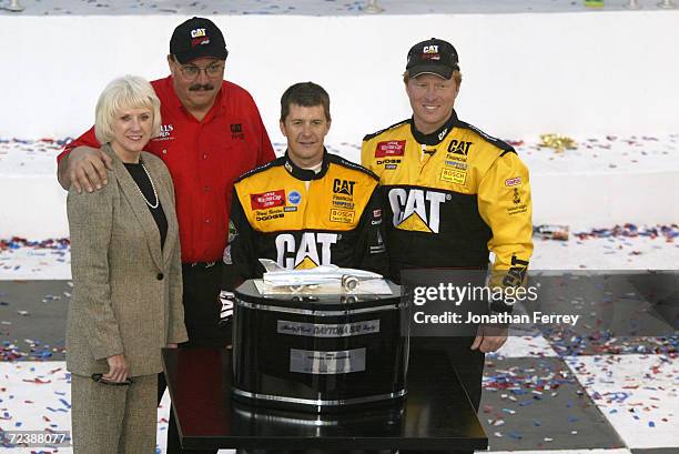 Ward Burton driver of the Bill Davis Racing Dodge Intrepid R\\T celebrates with team onwers Bill and Gail Davis and crew chief Tommy Baldwin after...