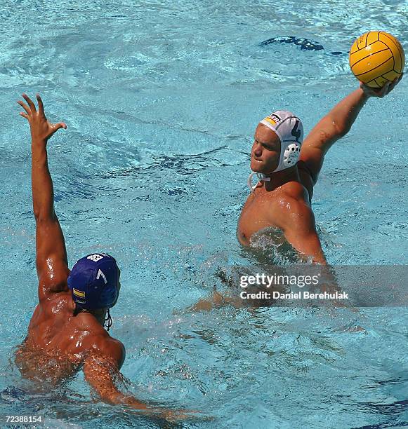 Patrick Weissenger of Germany looks to shoot past Gabriel Hernandez of Spain in the men's Water Polo classification game between Germany and Spain on...