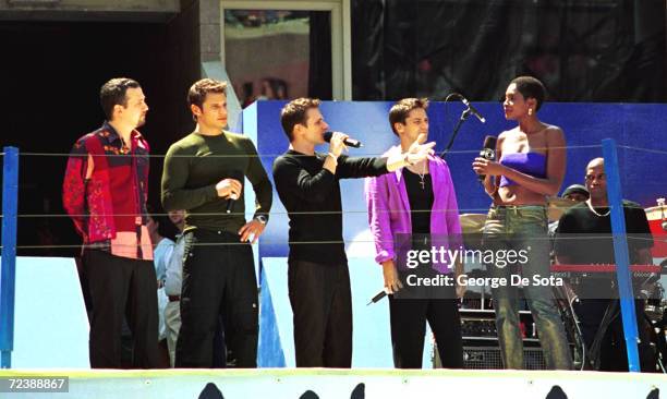 Teen sensations 98 degrees and Roshumba Williams attend the Arthur Ashe Kid's Day Family and Music Festival August 26, 2000 at the USTA National...