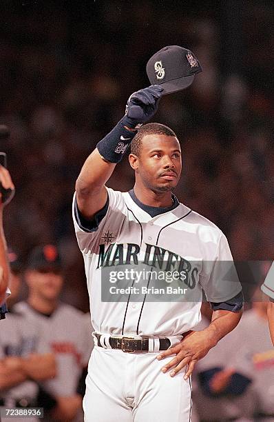 Ken Griffey Jr. #24 of the American League Team waves to the crowd during the line up before the 1999 MLB All-Star Game against the National Team at...