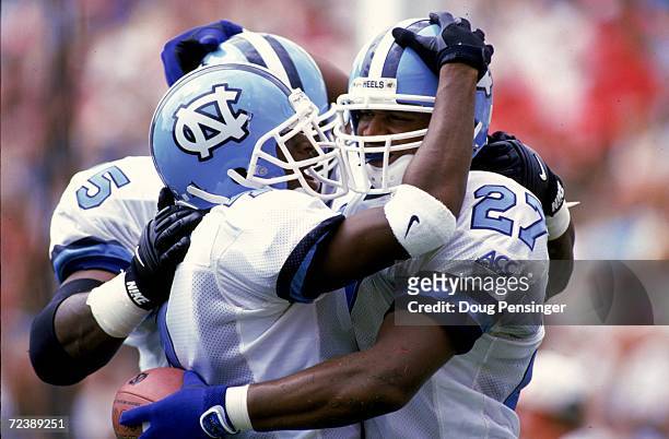 Jonathan Linton of the North Carolina Tar Heels celebrates with teammate Octavus Barnes during a game against the Maryland Terrapins at the Byrd...