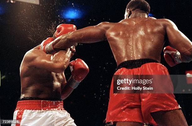 Evander Holyfield lands a left hook during fight against Riddick Bowe in Las Vegas, Nevada. Mandatory Credit: Holly Stein /Allsport