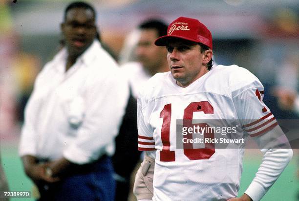 Quarterback Joe Montana of the San Francisco 49ers watches from the sidelines during the NFL Super Bowl XXIV Game against Denver Broncos at the...