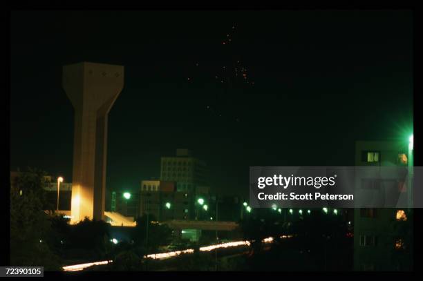 Anti-aircraft gunfire lights up the sky as Iraqi forces respond to December 20, 1998 missile strikes by American and British forces in Baghdad, Iraq....