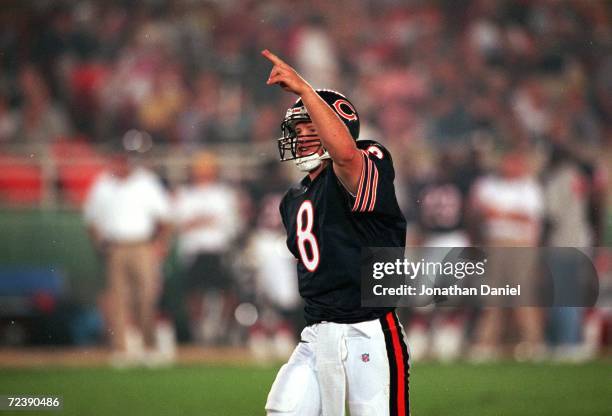 Cade McNown of the Chicago Bears gives a signal on the field during a pre-season game against the Indianapolis Colts at the Soldier Stadium in...