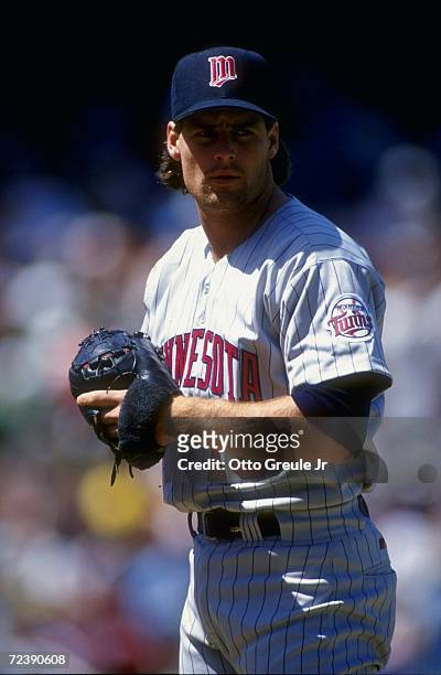 Pitcher Scott Erickson of the Minnesota Twins in his wind up during a game against the Oakland Athletics at the Oakland Coliseum in Oakland,...