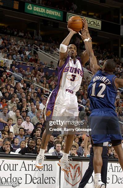 Stephon Marbury of the Phoenix Suns shoots over Chris Whitney of the Washington Wizards during their game at America West Arena in Phoenix, AZ. The...