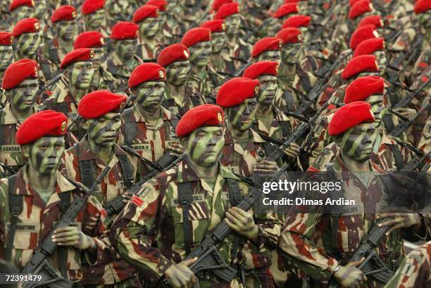 Troops from the Indonesian Army's Raider Battalion march as some 11,000 soldiers participate in an Army Day parade on December 22, 2003 at Kemayoran...