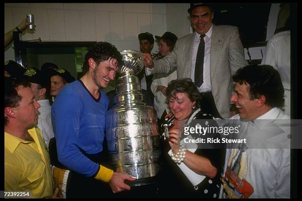 Pittsburgh Penguins players celebrate with the Stanley Cup.