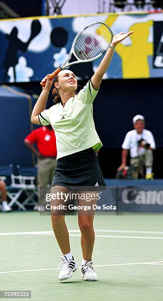 Tennis star Martina Hingis plays a match August 26, 2000 against Arantxa Sanchez-Vicario at the Arthur Ashe Kid's Day Family and Music Festival...