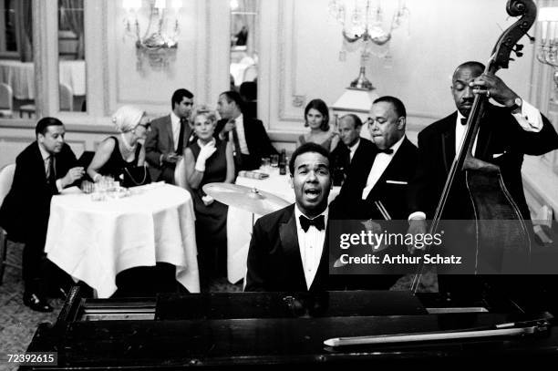 Entertainer Bobby Short performing with his band, probably at the Cafe Carlyle.