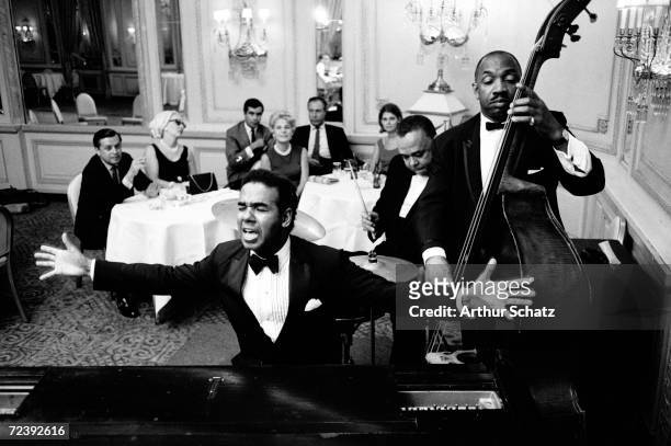 Entertainer Bobby Short performing with his band, probably at the Cafe Carlyle.