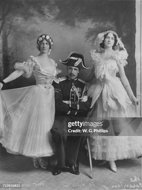 The host and two guests at a fancy dress ball given by Conservative politician Lord Winterton and Mrs F.E. Smith at Claridge's hotel, London, 1910....