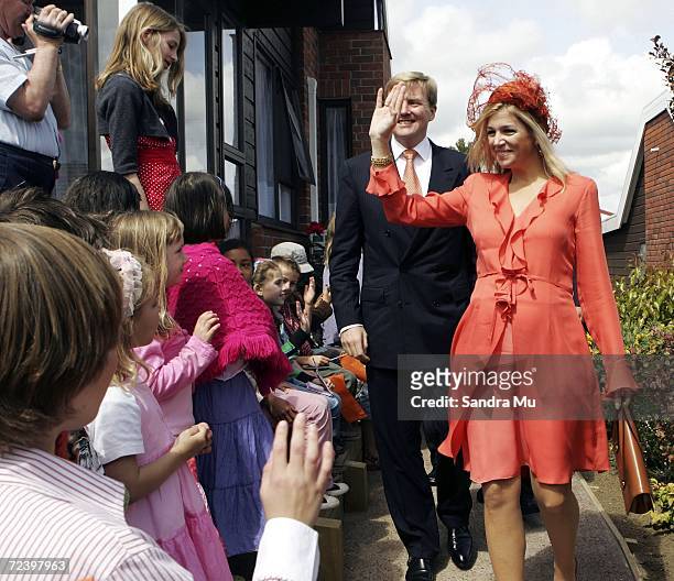 Princess Maxima of The Netherlands waves goodbye to local Dutch children as she and His Royal Highness The Prince of Orange leave after a visit to...