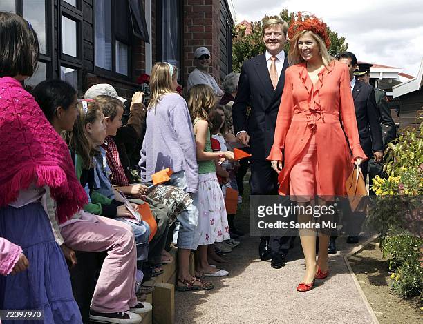 His Royal Highness The Prince of Orange and Princess Maxima of The Netherlands greet local Dutch children as they walk to their car after a visit to...