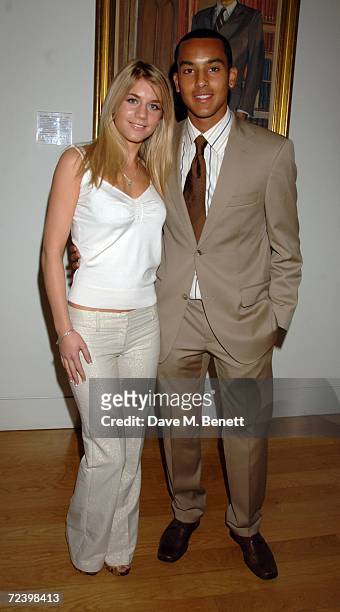 Footballer Theo Walcott and partner Melanie Slade attend the gala opening of the Exceptional Youth Exhibition hosted by Teen Vogue's editor in chief...