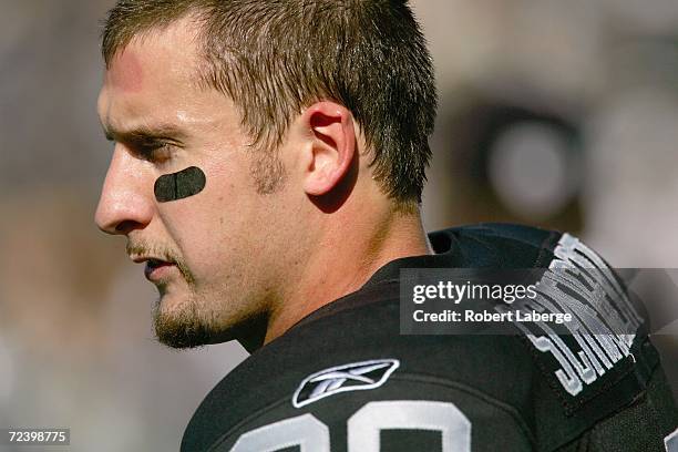 Safety Stuart Schweigert of the Oakland Raiders stands on the sideline during an NFL game against the Pittsburgh Steelers at McAfee Coliseum on...