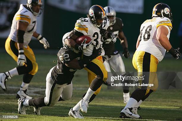 Linebacker Kirk Morrison of the Oakland Raiders tackles running back Willie Parker of the Pittsburgh Steelers during an NFL game at McAfee Coliseum...