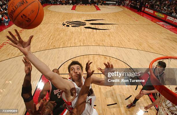 Andrea Bargnani of the Toronto Raptors grabs for a rebound during a game against the Milwaukee Bucks on November 3, 2006 at the Air Canada Centre in...