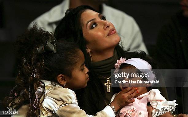 Vanessa Bryant, the wife of Kobe Bryant of the Los Angeles Lakers, sits with their two girls Natalia Diamante and Gianna Maria-Onore before the game...