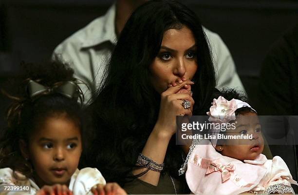Vanessa Bryant, the wife of Kobe Bryant of the Los Angeles Lakers, sits with their two girls Natalia Diamante and Gianna Maria-Onore before the game...
