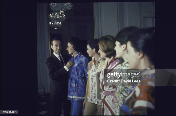 Fashion designer Emilio Pucci with models wearing his designs.