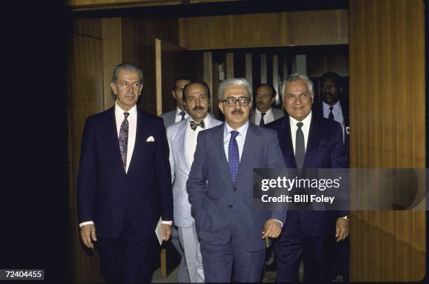 Iraqi Foreign Minister Tareq Aziz and Iraqui UN Repersentative Ismat Kittani arriving with others for a meeting during mediated Iran-Iraq war peace...