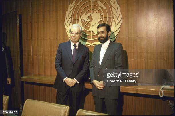 Secretary General Javier Perez de Cuellar posing with Iranian Foreign Minister Ali Akbar Velayati during the UN mediated Iran-Iraq war peace talks.