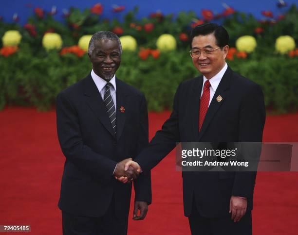 South African President Thabo Mbeki is greeted by Chinese President Hu Jintao during the welcoming ceremony for representatives attending the Beijing...