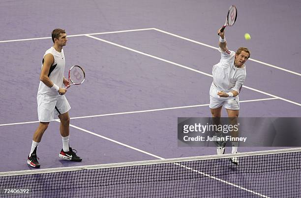 Jonas Bjorkman of Sweden and Max Mirnyi of Belarus in action against Arnaud Clement and Michael Llodra of France in the semi finals of the doubles...