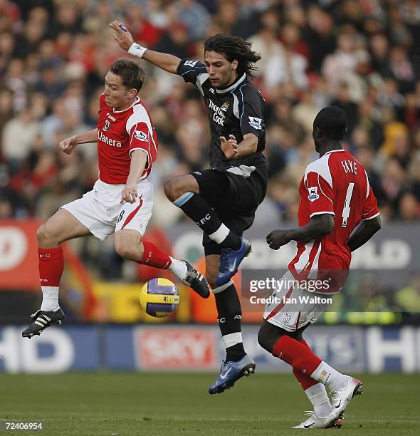 Matt Holland of Charlton Athletic tries to tackle Georgios Samaras of Manchester City during the Barclays Premiership match between Charlton Athletic...