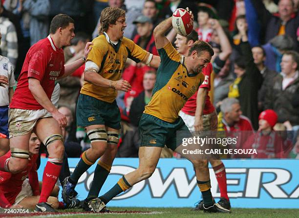 Cardiff, UNITED KINGDOM: Australia's Chris Latham celebrates scoring his try during their rugby union international match against Wales at the...