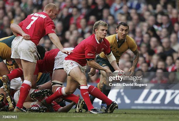 Dwayne Peel of Wales passes the ball away from a ruck during the Invesco International match between Wales and Australia at the Millennium Stadium on...