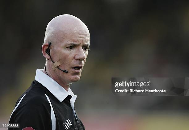 Referee Dermot Gallagher wears a communication headset during the Barclays Premiership match between Watford and Middlesbrough at Vicarage Road on...