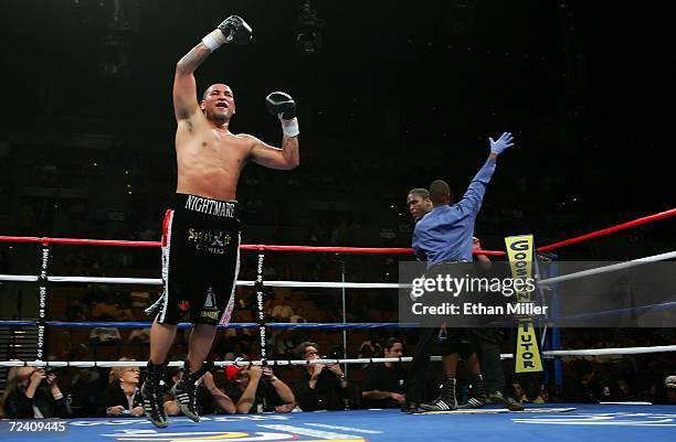 Chris Arreola jumps in the air as referee Kenny Bayless comes in to stop the fight in the 7th round against Damian Wills during their heavyweight...