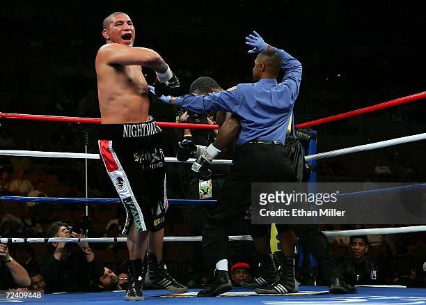 Chris Arreola jumps in the air as referee Kenny Bayless comes in to stop the fight in the 7th round against Damian Wills during their heavyweight...