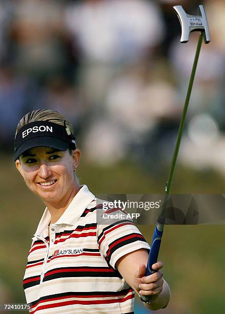 Karrie Webb of Australia reacts after her winning putt in the 18th hole at the 1.2 million USD USLPGA Tour Mizuno Classic Golf tournament in Shima,...