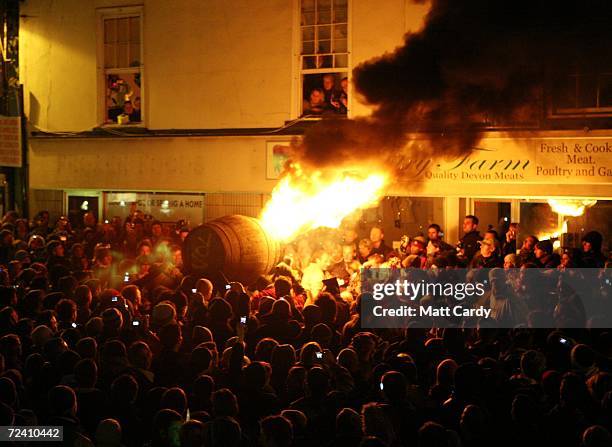 Crowds gather around a burrning barrel soaked in tar on November 4 2006 in Devon, England. The 400-year-old event at Ottery St Mary's carnival on 4...