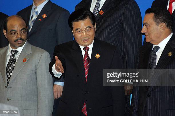 Chinese President Hu Jintao ushers his Egyptian counterpart Hosni Mubarak and Ethiopian Prime Minister Meles Zenawi , to announce the new partnership...