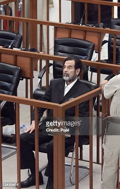 Former Iraqi President Saddam Hussein as he receives his guilty verdict during his trial in the fortified 'green zone', on November 5, 2006 in...