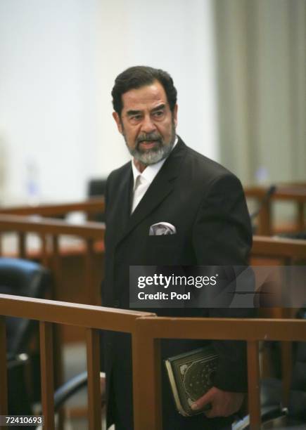 Former Iraqi President Saddam Hussein as he receives his guilty verdict during his trial in the fortified 'green zone', on November 5, 2006 in...