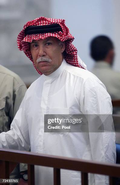 Barzan Ibrahim, half brother of former Iraqi President Saddam Hussein reacts after being sentenced to death during his trial in the fortified 'green...