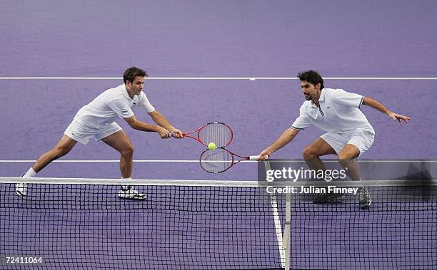 Fabrice Santoro of France and Nenad Zimonjic of Serbia & Montengro in action in their match against Arnaud Clement and Michael Llodra of France in...