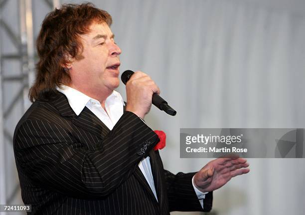 Entertainer Tony Marshall sings during the birthday party of German soccer legend Uwe Seeler at the AOL Arena on November 5, 2006 in Hamburg. Today...