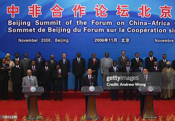 Chinese President Hu Jintao , his Egyptian counterpart Hosni Mubarak and Ethiopian Prime Minister Meles Zenawi read a joint declaration as the rest...