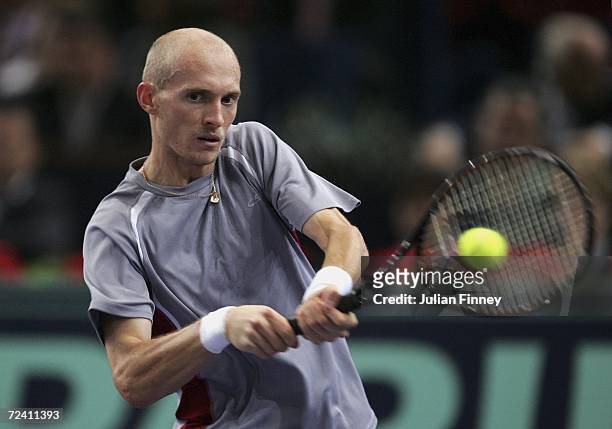 Nikolay Davydenko of Russia plays a backhand in his match against Dominik Hrbaty of Slovakia in the final during day seven of the BNP Paribas ATP...