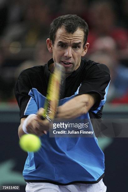 Dominik Hrbaty of Slovakia plays a backhand in his match against Nikolay Davydenko of Russia in the final during day seven of the BNP Paribas ATP...